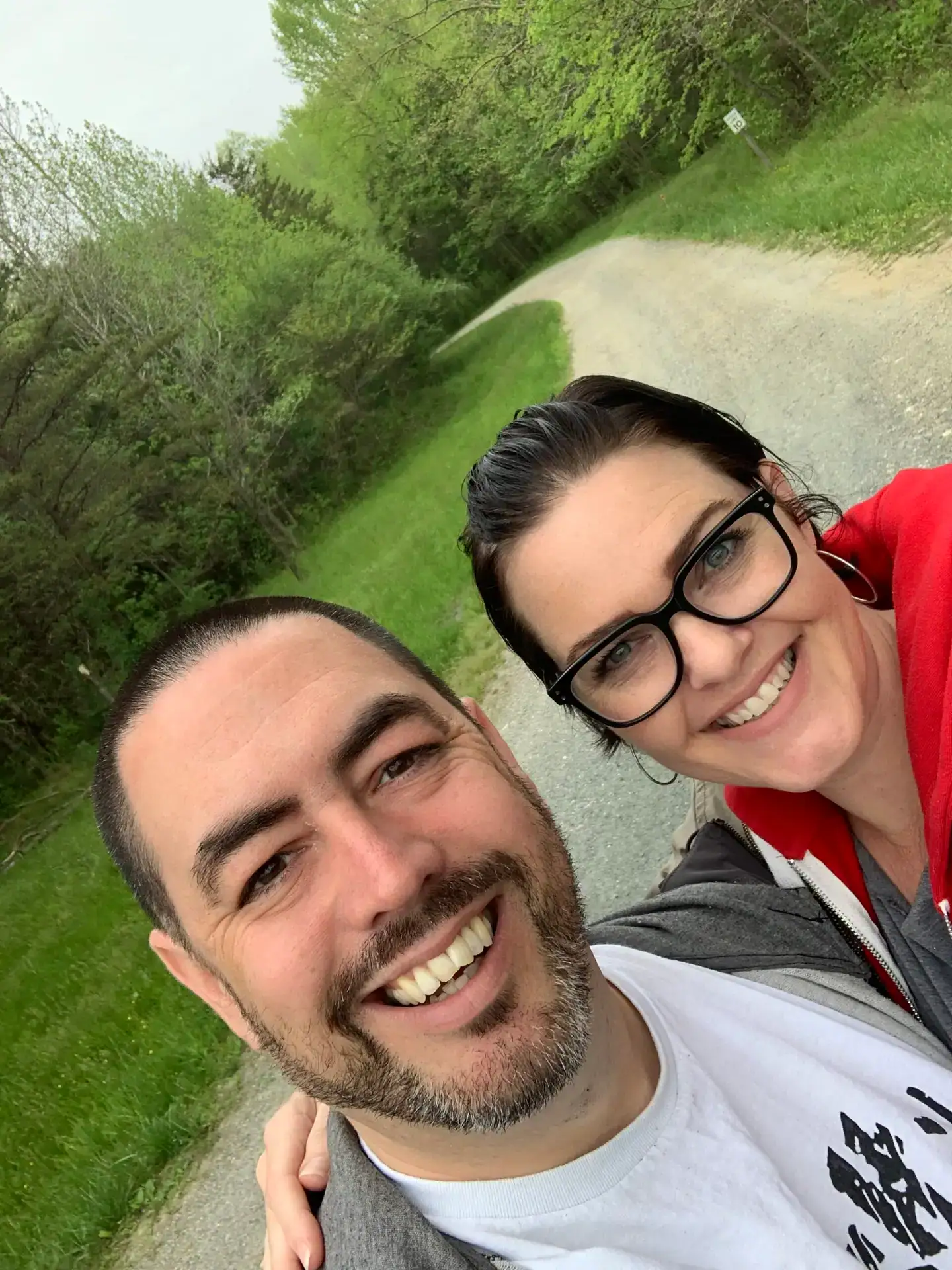 A picture of Kevin and Laura Wilson, the smiling owners of Camp Yellow Cardinal.